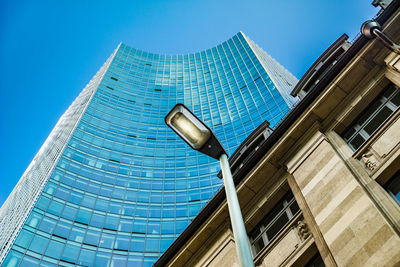 Low angle view of office building against sky