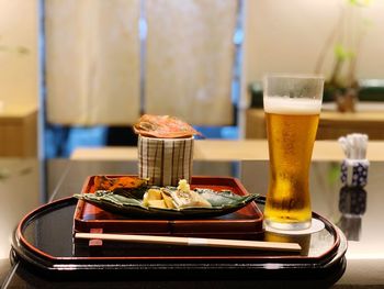 Close-up of beer glass on table