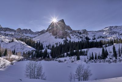 Scenic view of snowcapped mountains against sky during winter