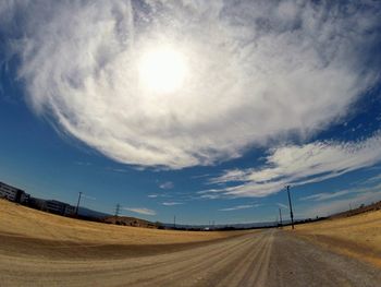 Scenic view of landscape against blue sky