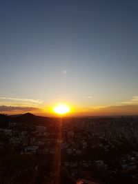 Aerial view of townscape against sky during sunset