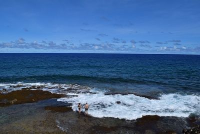 Scenic view of sea against blue sky