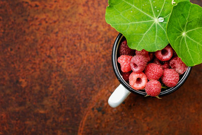 High angle view of strawberries in bowl on table