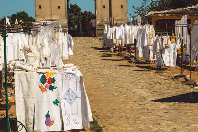 Clothes hanging on street by building