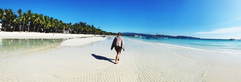 Full length of man on beach against sky