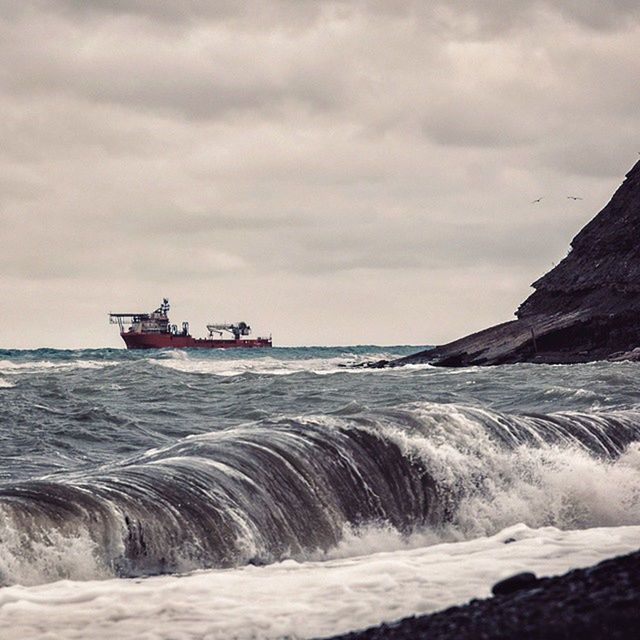 sea, water, nautical vessel, transportation, mode of transport, sky, boat, horizon over water, scenics, waterfront, wave, beauty in nature, cloud - sky, nature, tranquil scene, travel, tranquility, sailing, cloudy, surf