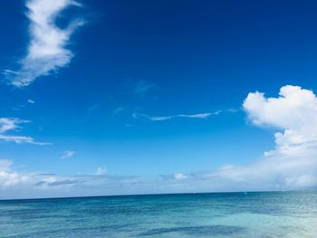 Scenic view of sea against blue sky