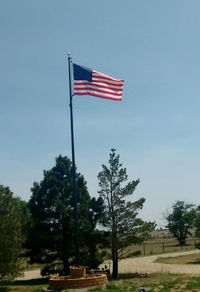 Low angle view of american flag against clear sky