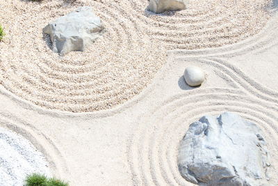 High angle view of stones on sand