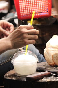 Midsection of person holding ice cream