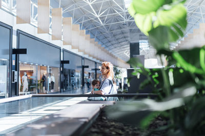 Full length portrait of woman sitting in bus