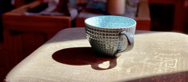 Close-up of coffee cup on table