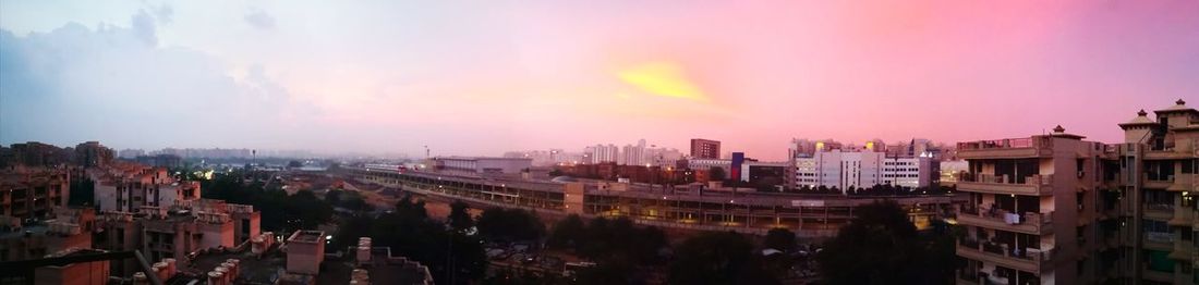 High angle view of buildings against sky during sunset