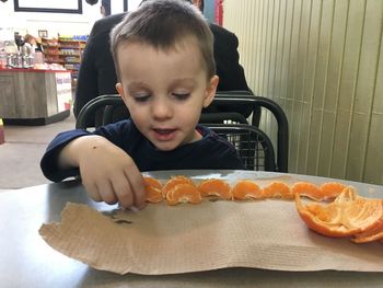 Boy looking at table