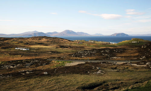 Scenic view of landscape and mountains against sky