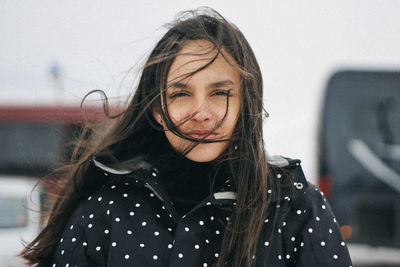 Close-up of woman with tousled hair