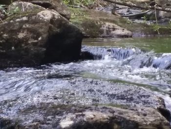 Close-up of water flowing in river