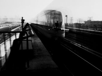 Man on bridge against sky