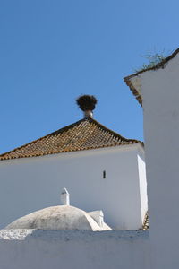 Parroquia del salvador in la villa, ayamonte stork nest on historic andalusian church 