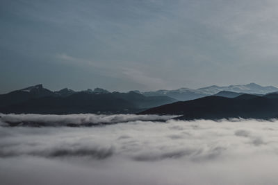 Scenic view of snowcapped mountains against sky