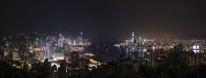 High angle view of illuminated buildings in city at night