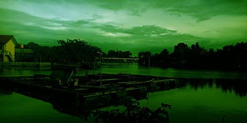 Scenic view of lake against sky at sunset