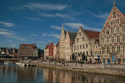 Old buildings in front of canal in ghent. a city full of gothic buildings in belgium.