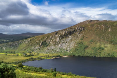 Panorama with lake, beach, forest, valley and rocky mountain. lough dan in wicklow mountains ireland