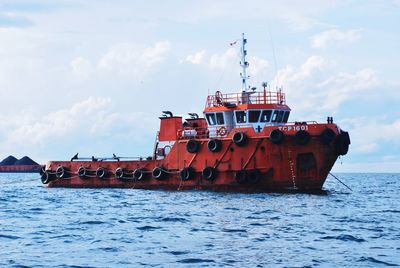 Traditional ship on sea against sky