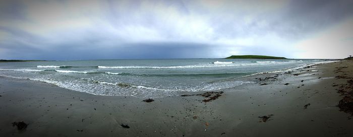 Scenic view of beach against sky