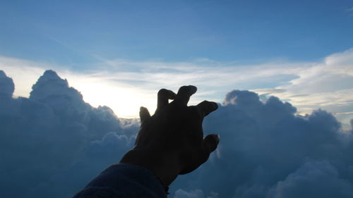 Low angle view of silhouette person against sky