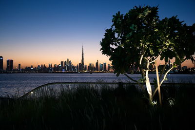 Dubai skyline from dubai creek harbour and dubai canal to downtown and business bay, uae