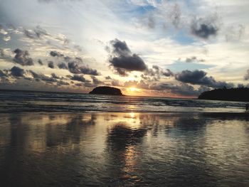 Scenic view of sea against sky at sunset