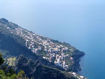 High angle view of townscape by sea