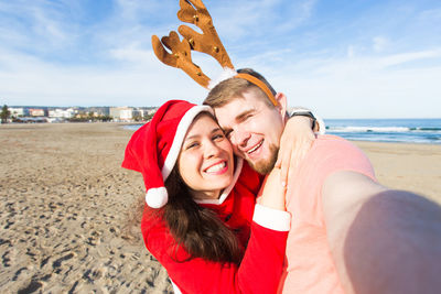 Portrait of smiling young woman on beach