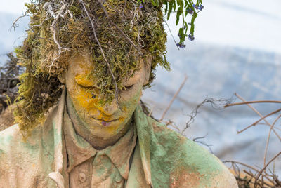 Close-up of man with dirty make-up