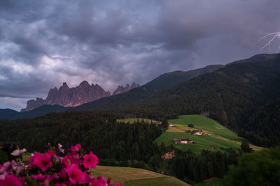 Scenic view of mountains against cloudy sky