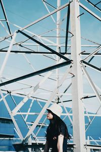 Woman standing against sky