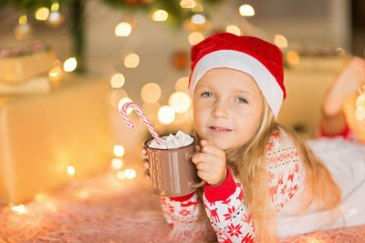 Portrait of cute girl drinking glass