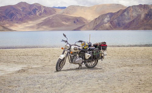 Bicycles on land against mountains