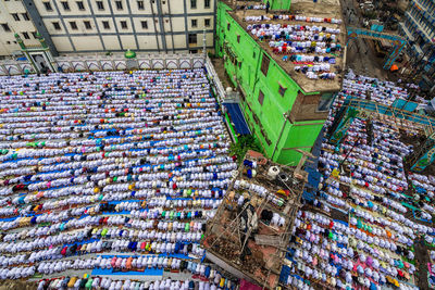 High angle view of islamic men praying outdoors