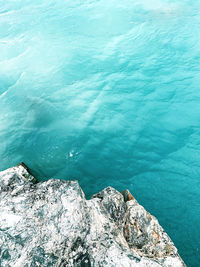 High angle view of rock formation in sea