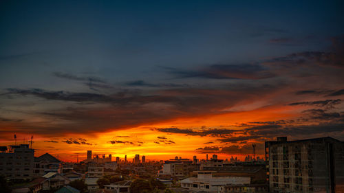 High angle view of buildings against sky during sunset