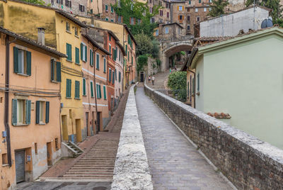 Footpath amidst buildings in town