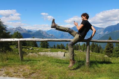 Full length of man standing on land against sky