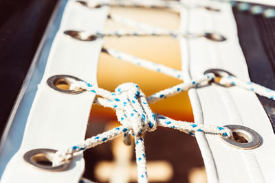 High angle view of rope tied on metal