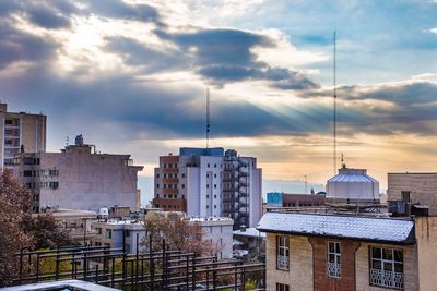 High angle view of buildings in city against sky