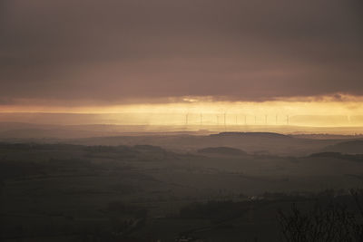 Scenic view of landscape against sky during sunset