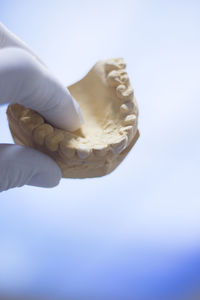 Close-up of hand holding ice cream