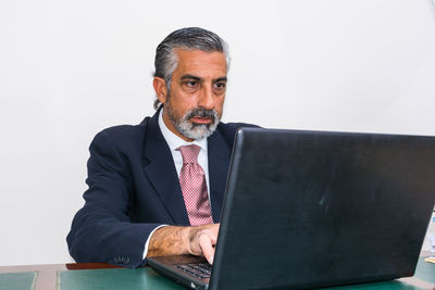Mid adult man using mobile phone